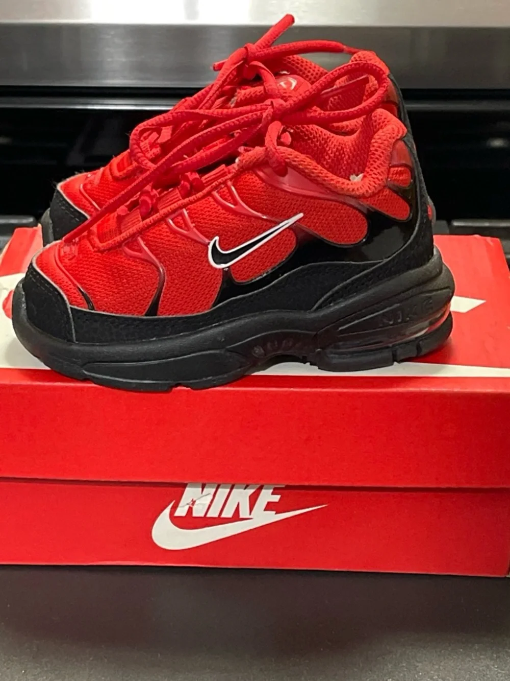 Nike Little Air Max Plus Toddler Sneakers in Red and Black